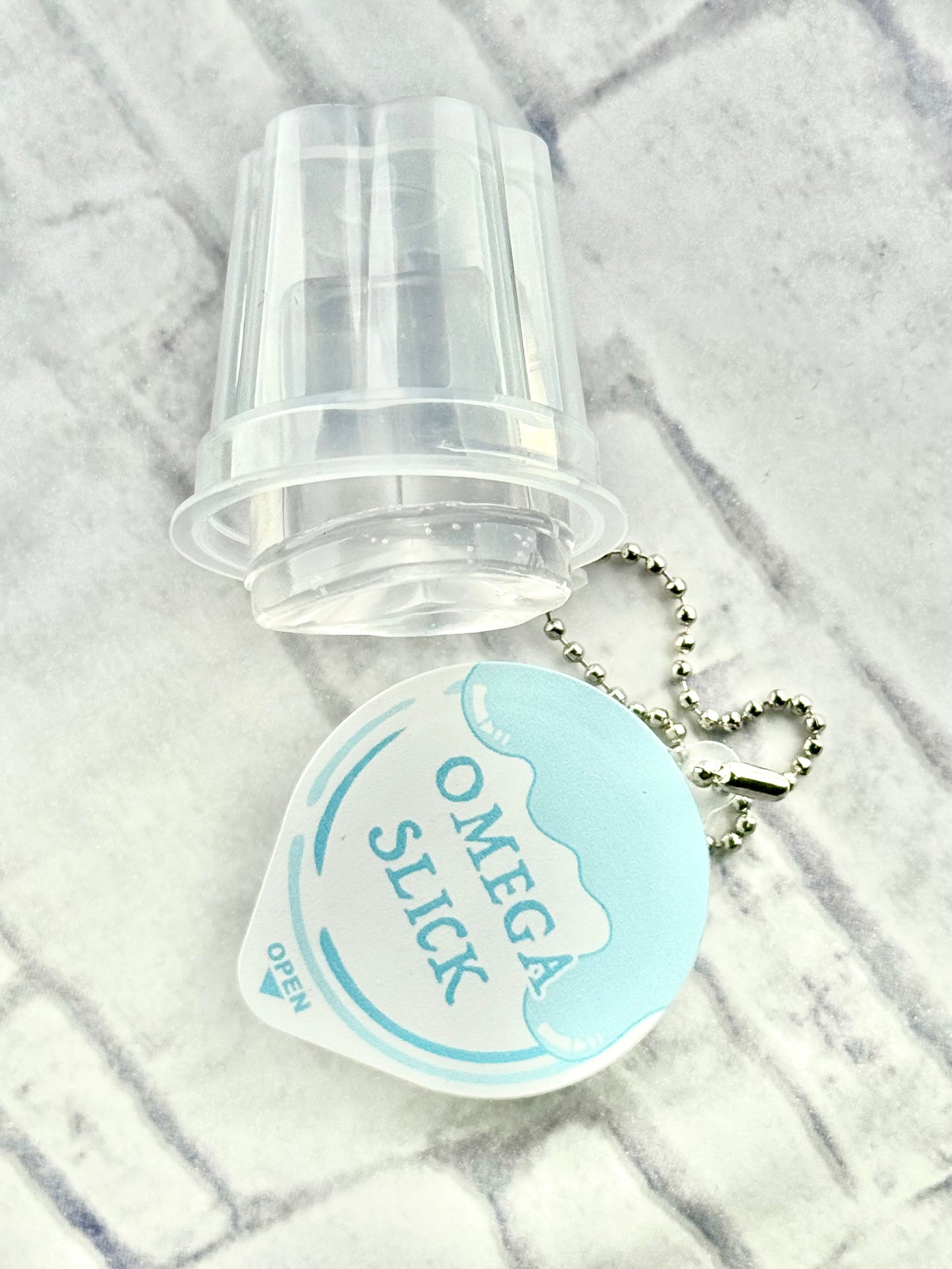 Omega Slick Pudding Cup Keychain (pre-order)